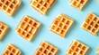 © horizon - Square waffles arranged symmetrically against a light blue background, featuring golden brown textures and clean aesthetics in flat lay photography, showcasing a breakfast food concept.
