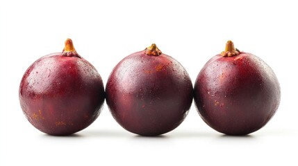 Wall Mural - Three round, purple fruits arranged in a row on a white background.