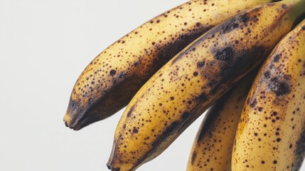 Poster - A close-up of ripe bananas with brown spots, showcasing their texture and ripeness.