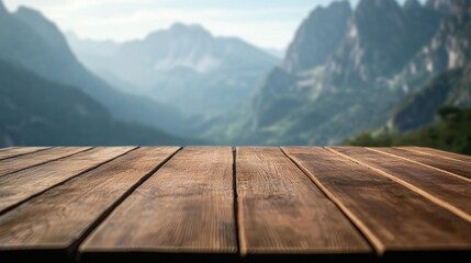 A wooden table in the foreground with a scenic mountain landscape in the background.