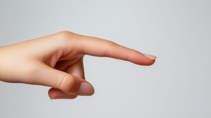 Wall Mural - A close-up of a hand with an outstretched finger against a neutral background.