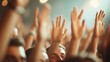 © Dulemegapixel - A lively event where audience members have their hands raised in excitement, capturing the energy and engagement of the crowd amidst a vibrant and dynamic atmosphere.