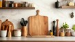 © AURA COLLECTIONS - A cozy kitchen countertop with wooden utensils, spices, and a cutting board for meal preparation.
