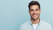 © PondLord - Handsome man with short hair, wearing a casual button-up shirt, smiling confidently against a light blue solid color background