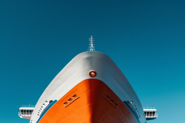 Canvas Print - A large ship with a red and white stripe on the side