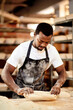 © HockleyM3/peopleimages.com - Male person, work and baking bread in kitchen as small business or entrepreneur in cafe or bakery. Black man, pastry chef and restaurant in preparing sourdough recipe with pride, skill and confidence