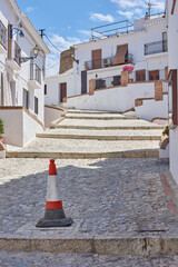 Wall Mural - Town, cobblestone and outdoor for weekend trip, Europe summer and street for peace in Frigiliana. Buildings, architecture and culture in Spain for tourism, holiday and calm environment on vacation