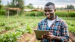 © Shahriar507 - Young African Male Farmer Working on Healthy Agriculture Development Strategy on His Digital Tablet