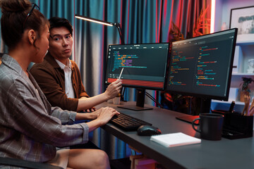 Wall Mural - it developers discussing with point to intelligent website development coder system running data onl