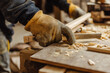 © HecoPhoto - Closeup of Carpenters Hand Using a Chisel to Work on Wood