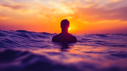 silhouette of a man swimming during a vibrant sunset over the ocean, tranquil evening scene. nature and serenity concept