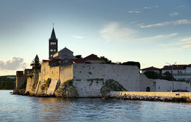 The walls of the old town of Rab on the island of Rab from the sea