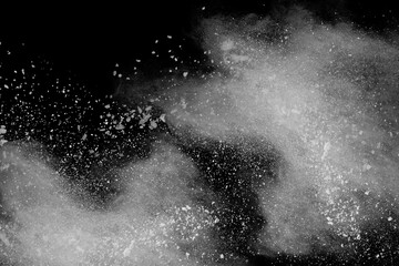 Wall Mural - white powder explosion on black background. colored cloud. colorful dust explode. paint holi.