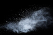 © kitsana - White powder explosion on black background. Colored cloud. Colorful dust explode. Paint Holi.