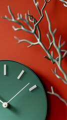 Sticker - Modern green wall clock with branch design on red background, artistic and contemporary decor concept