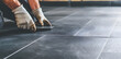 © photo for everything - Worker Laying Ceramic Tiles on the Floor of an Apartment | Professional Tiling and Precision Flooring Installation