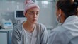 © VK Studio - A person in a medical setting wearing a pink headscarf looks thoughtfully at a doctor, illustrating a moment of engagement and care in a healthcare environment.