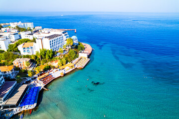 Kusadasi, Aydin, Turkey. Ladies Beach (Turkish: Kadinlar Denizi) in Kusadasi. Touristic beach resort town on Turkey. Aerial view of Kusadasi.