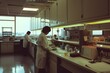 © Victor Bertrand - Scientists in white lab coats work diligently in a sterile, well-lit laboratory, surrounded by high-tech equipment and meticulously organized workstations.
