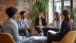 © sungedi - A Diverse Group of Professionals Engage in a Meeting Around a Table in a Modern Office Setting