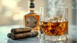 © Ziyan - A bottle and a glass of whiskey with ice and a steaming Cuban cigar
