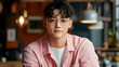 © Neural9 Project - Young Man with Glasses Smiles Gently in a Warmly Lit Cafe Setting