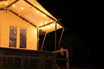 Poster - Tent in mountains at night, space for text. Glamping site