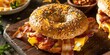 © TheWaterMeloonProjec - Bird's-eye view of a homemade breakfast sandwich featuring bacon, egg, and cheese on a wooden board.