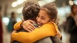 © kop - family hugging each other after a long separation at an airport, with emotions running high