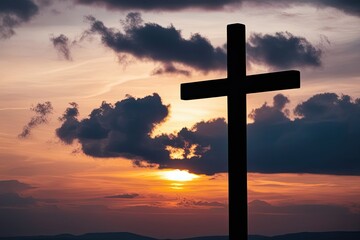 Wall Mural - Cross of Jesus Christ Against a Sunset Sky in a Christian Religion Concept