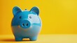 © B 7 YOU - Blue piggy bank on a yellow background.