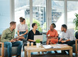 © Frank Coop/peopleimages.com - Creative, team and business people with laptop on sofa for design strategy, online campaign and website layout. Graphic designer, collaboration or diversity in modern office for project brainstorming