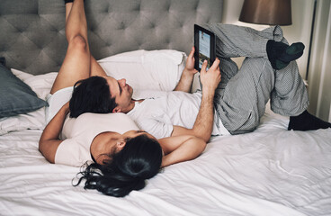 Poster - Couple, relax and research tablet on bed for travel destination, holiday location and scroll vacation website. Love, people and resting in bedroom with digital app for bonding, relationship and care