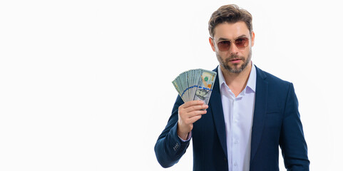 Business man hold money on white studio isolated background. Rich man in suit with money dollar bills. Successful businessman with dollar banknotes. Rich millionaire in suit holding money, banner.