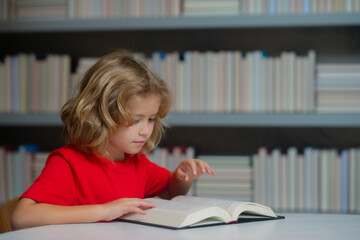 School and education concept. School pupil with pile of books. Children enjoying book story in school library. Kids imagination, interest to literature. Kids clever.