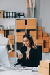 © ARMMY PICCA - Successful Woman start up online seller at workplace. small business entrepreneur SME or freelance asian woman working with box at home.