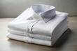 © Jason - Stack of clean folded white shirt on table