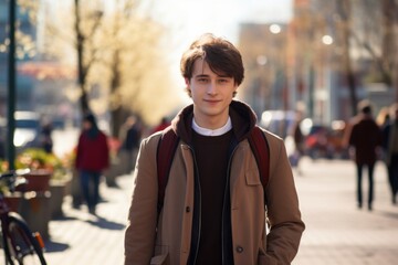 Wall Mural - A young man wearing a brown coat