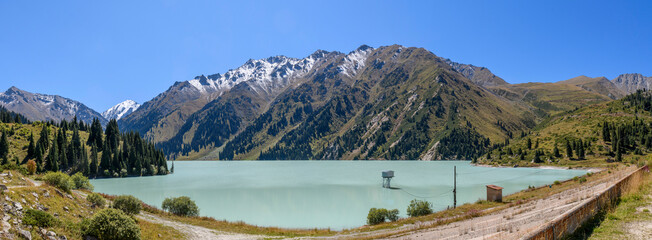 Wall Mural - Beautiful mountain lake, forest and mountains. Big Almaty lake in summer time. Mountain landscape in Kazakhstan.