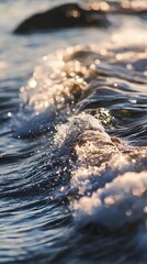 Canvas Print - Close-up of a wave crashing on the shore, with the sun reflecting off the water.