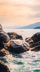 Poster - Rocky shoreline with calm water and a view of a mountain in the distance.