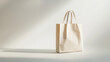 © Olha Havelia - Buy Nothing Day concept, empty shopping bag standing on a plain white surface, minimalistic and simple design, soft shadows, copy space on the left