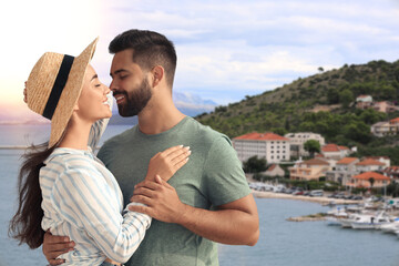 Wall Mural - Happy couple enjoying their honeymoon. Newlyweds during wedding trip