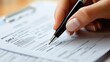 © CinimaticWorks - detailed closeup of hand writing on business documents with a pen highlighting the process of filling out forms and paperwork