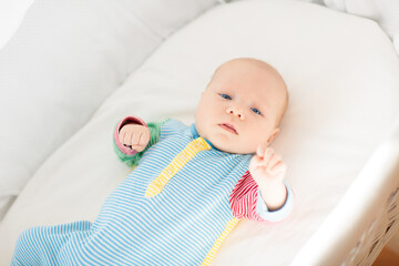 Wall Mural - little baby on white bed