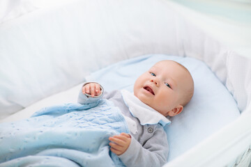 Wall Mural - little baby on white bed