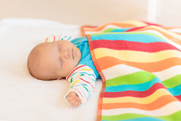 Wall Mural - little baby on white bed