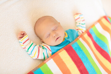 Wall Mural - little baby on white bed