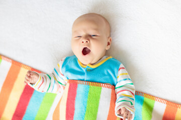 Wall Mural - little baby on white bed