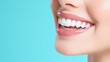 © Phisan - A close-up of a woman's confident smile, her white teeth gleaming against her smooth complexion,copy space for text,